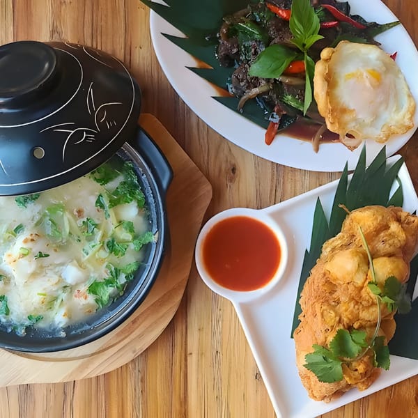 Zaab Zaab's Thai dishes: crab soup, basil stir-fry with fried egg, and fried shrimp cakes.