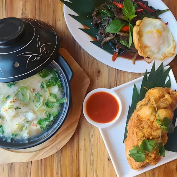 Zaab Zaab Thai dishes: crab omelet soup, stir-fried basil with fried egg, and fried shrimp cakes.